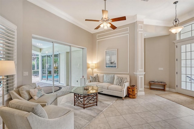 tiled living room with ceiling fan and crown molding