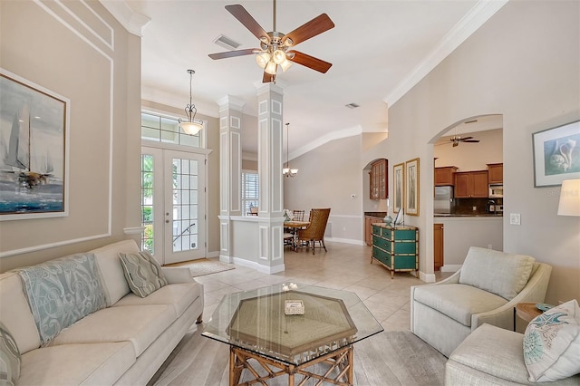 tiled living room with crown molding and ceiling fan