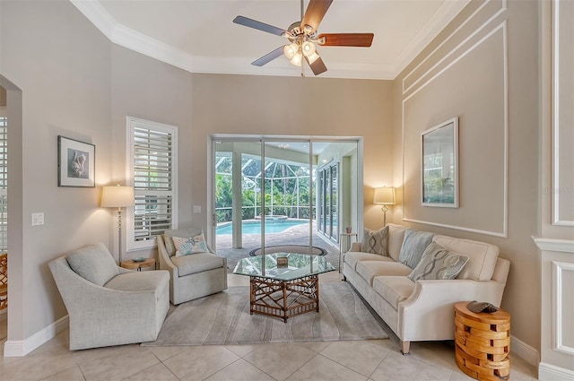 living room with crown molding, ceiling fan, and light tile floors