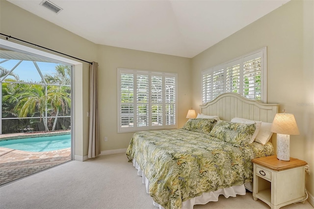 bedroom with multiple windows, light carpet, and access to outside