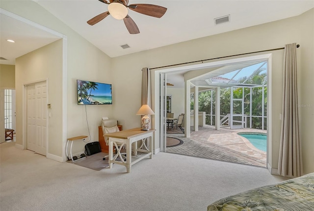 living room featuring vaulted ceiling, light carpet, and ceiling fan