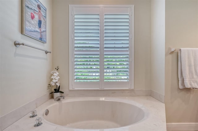 bathroom with a tub