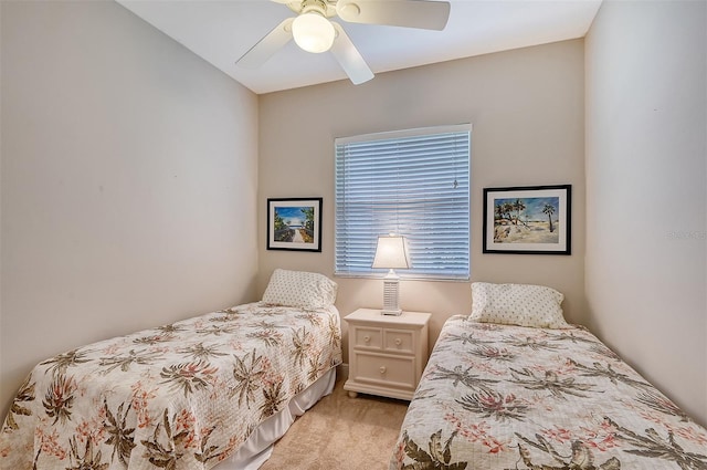 bedroom featuring ceiling fan and light colored carpet