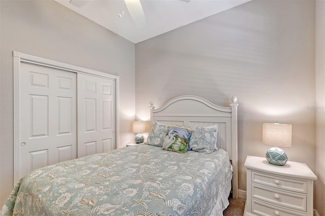 carpeted bedroom featuring a closet and ceiling fan