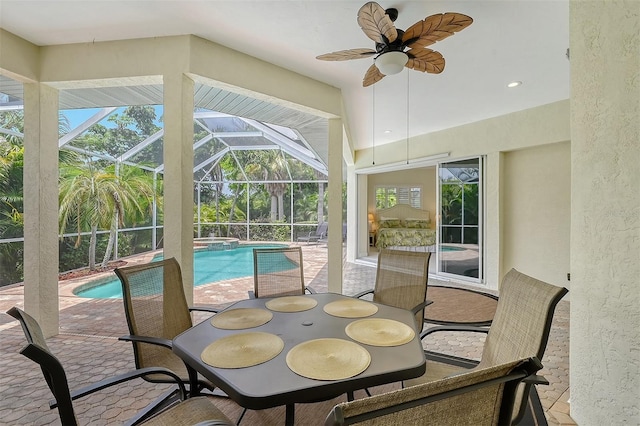 sunroom / solarium featuring a wealth of natural light and ceiling fan