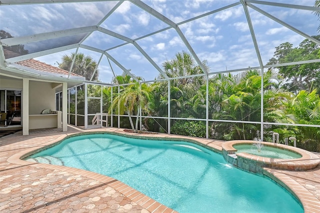 view of swimming pool with a patio area, pool water feature, an in ground hot tub, and a lanai