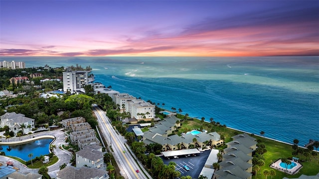 aerial view at dusk with a water view