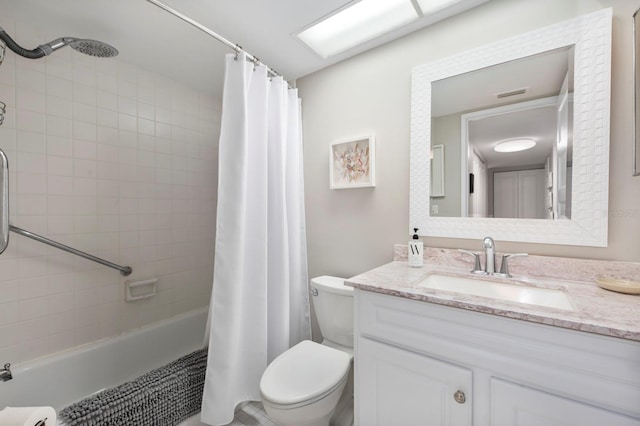 full bathroom with vanity, toilet, and shower / tub combo with curtain