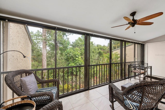 sunroom / solarium featuring ceiling fan