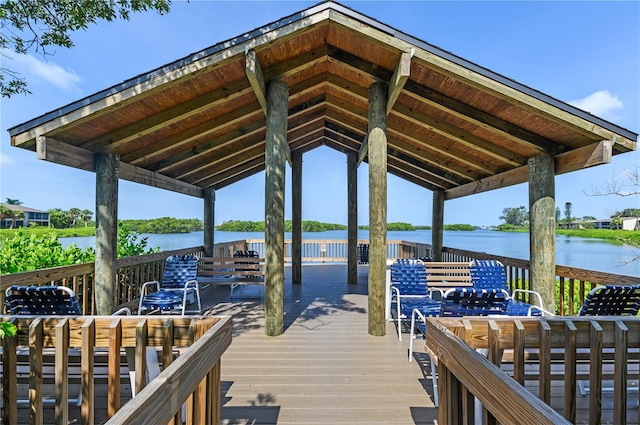 view of dock with a gazebo and a water view