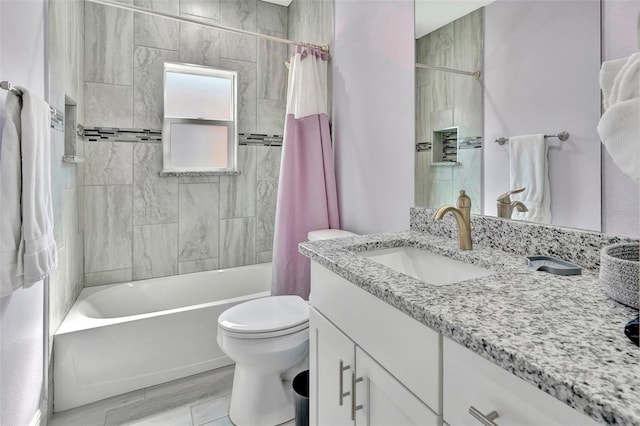 full bathroom featuring vanity, toilet, and shower / bath combo with shower curtain