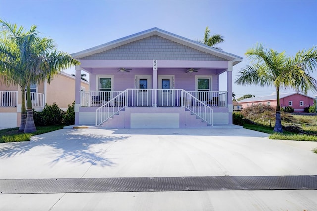 view of front of home with a porch and ceiling fan