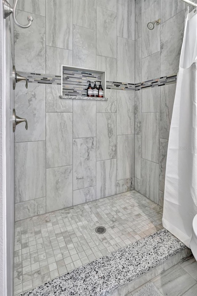 bathroom featuring walk in shower