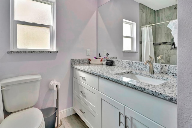 bathroom with oversized vanity and toilet