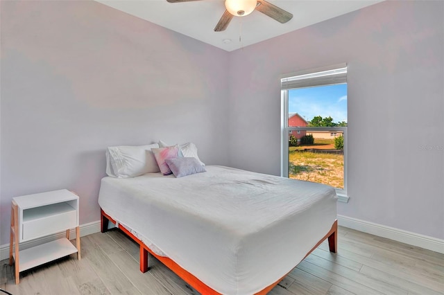 bedroom featuring ceiling fan and light hardwood / wood-style floors