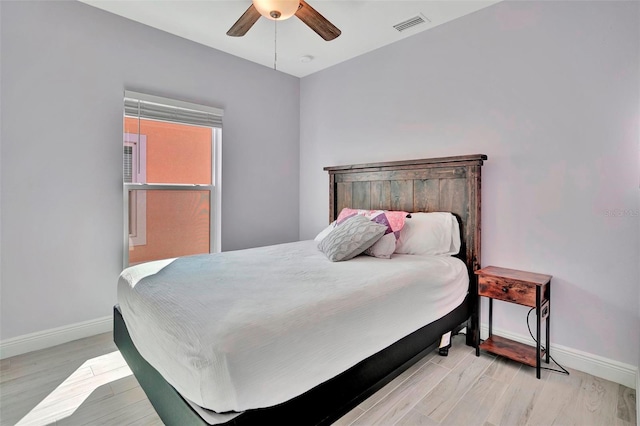 bedroom featuring ceiling fan and light hardwood / wood-style flooring