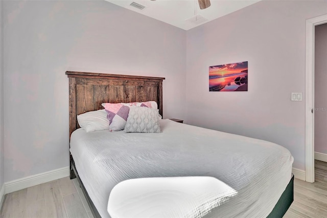 bedroom with ceiling fan and light wood-type flooring