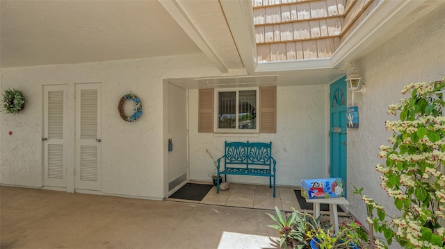 doorway to property with a patio area