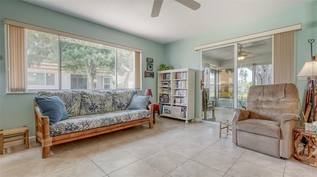 sitting room featuring tile floors and ceiling fan