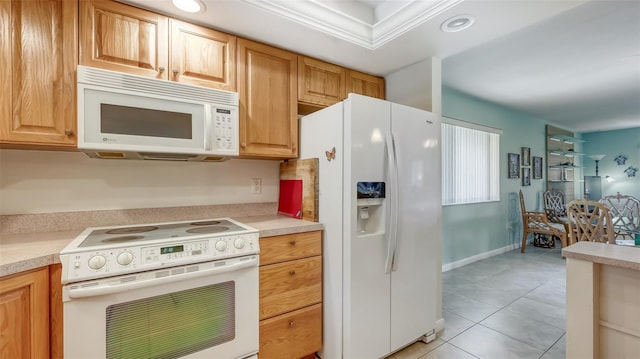 kitchen with white appliances and light tile flooring