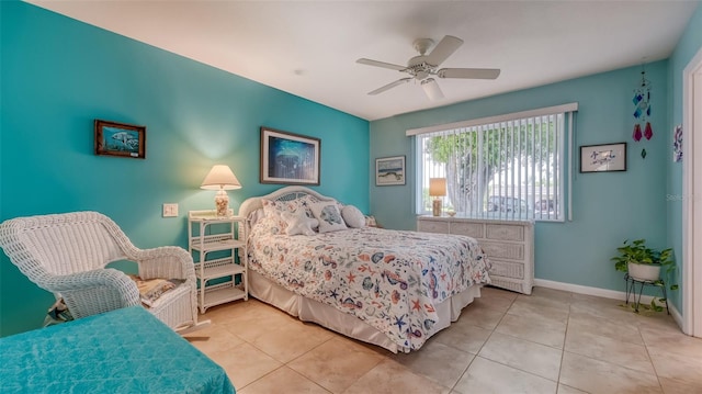 bedroom featuring ceiling fan and light tile floors