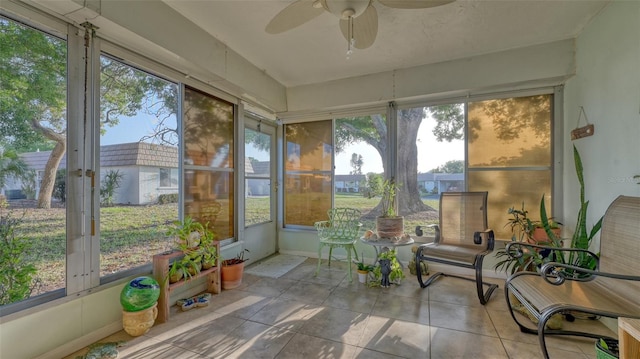 sunroom with plenty of natural light and ceiling fan