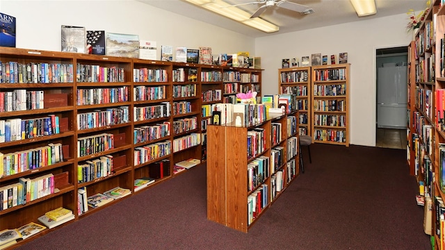 miscellaneous room featuring dark carpet