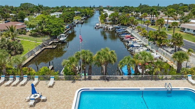 view of swimming pool featuring a water view