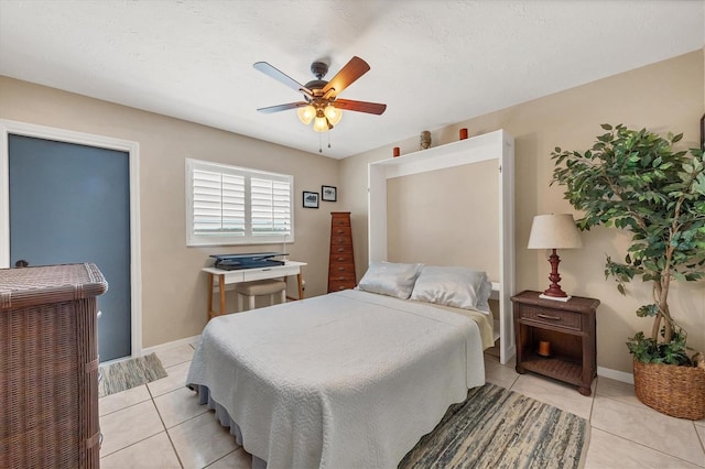 tiled bedroom with ceiling fan