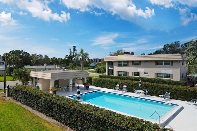 view of swimming pool featuring a patio