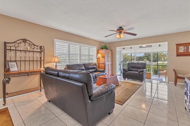 tiled living room featuring ceiling fan