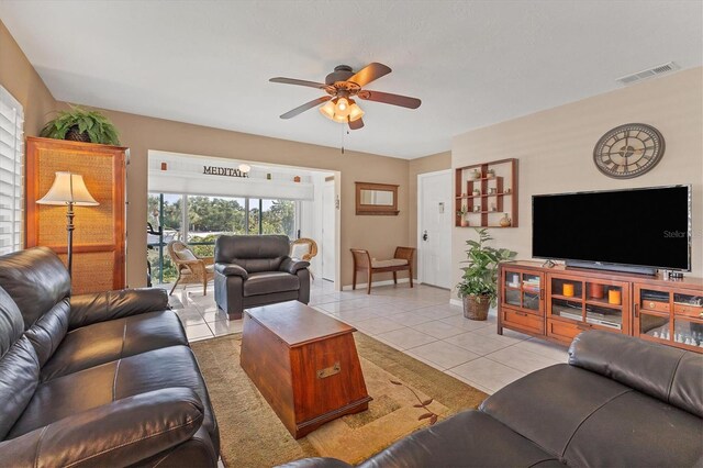 living room with ceiling fan and light tile floors