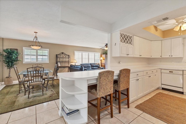 kitchen with ceiling fan, dishwasher, a healthy amount of sunlight, and light tile floors