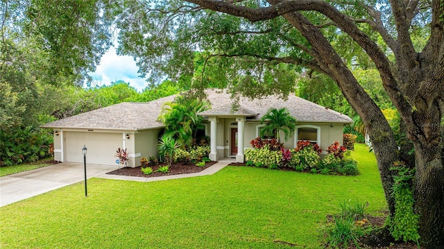 single story home featuring a garage and a front yard