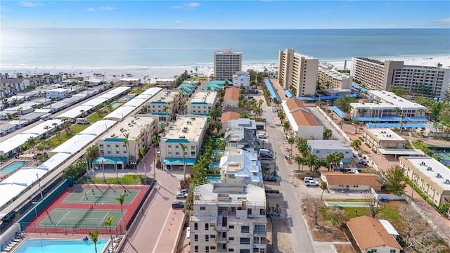 aerial view with a water view and a view of the beach