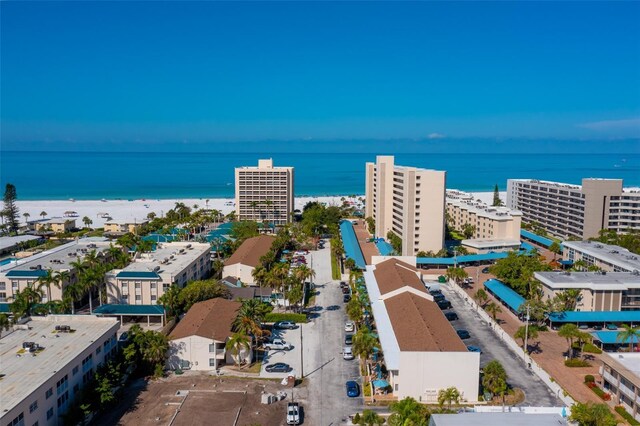 bird's eye view featuring a water view and a view of the beach