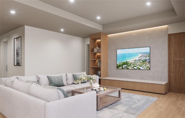 living room featuring light hardwood / wood-style floors and a raised ceiling