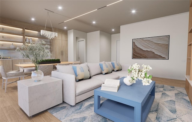 living room featuring light hardwood / wood-style flooring and a notable chandelier