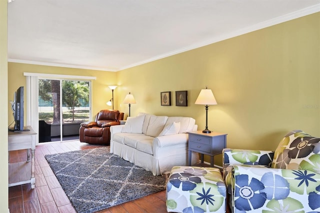 living room with wood-type flooring and crown molding