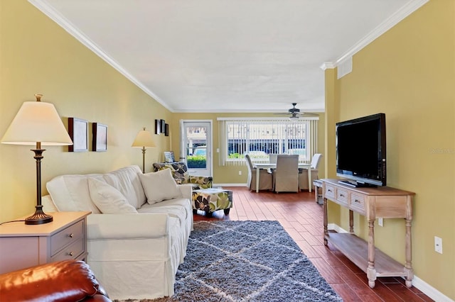 living room with hardwood / wood-style floors, ceiling fan, and ornamental molding