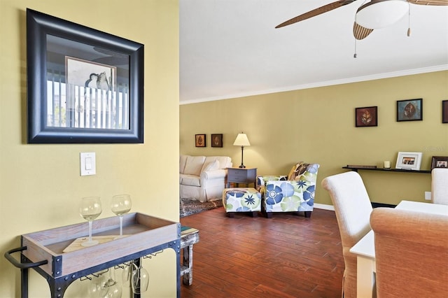 living room with ceiling fan, dark hardwood / wood-style flooring, and crown molding