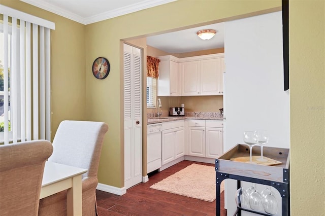 kitchen with crown molding, white cabinets, dark wood-type flooring, and white dishwasher