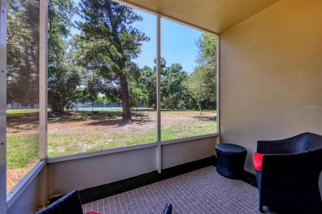 unfurnished sunroom with a wealth of natural light