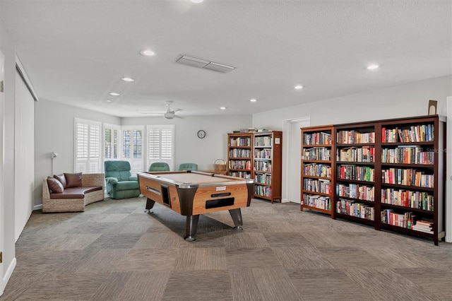 recreation room featuring light colored carpet, ceiling fan, and pool table