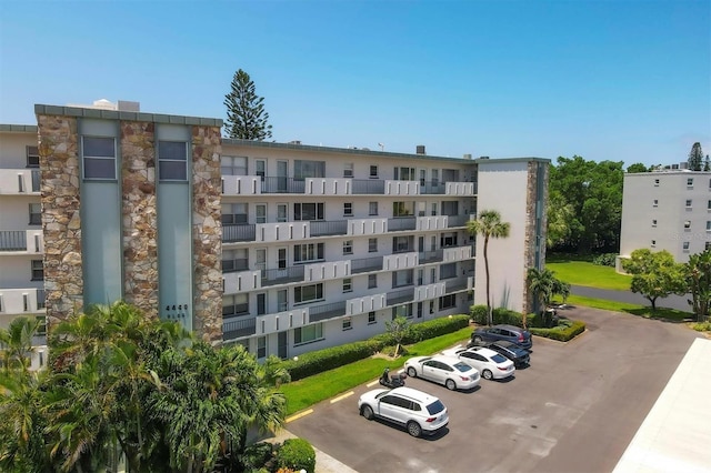 view of property featuring uncovered parking