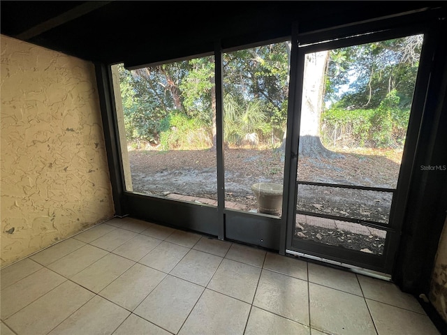 unfurnished sunroom with a healthy amount of sunlight