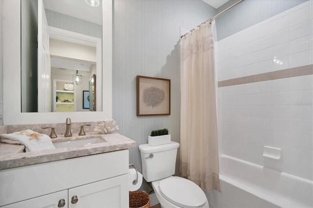 full bathroom with vanity, toilet, and shower / tub combo