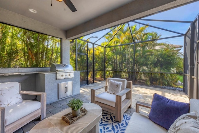 sunroom featuring ceiling fan