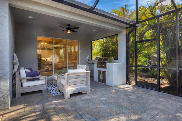 sunroom / solarium featuring ceiling fan