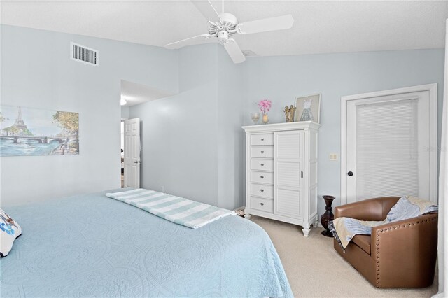 bedroom with lofted ceiling, carpet floors, and ceiling fan